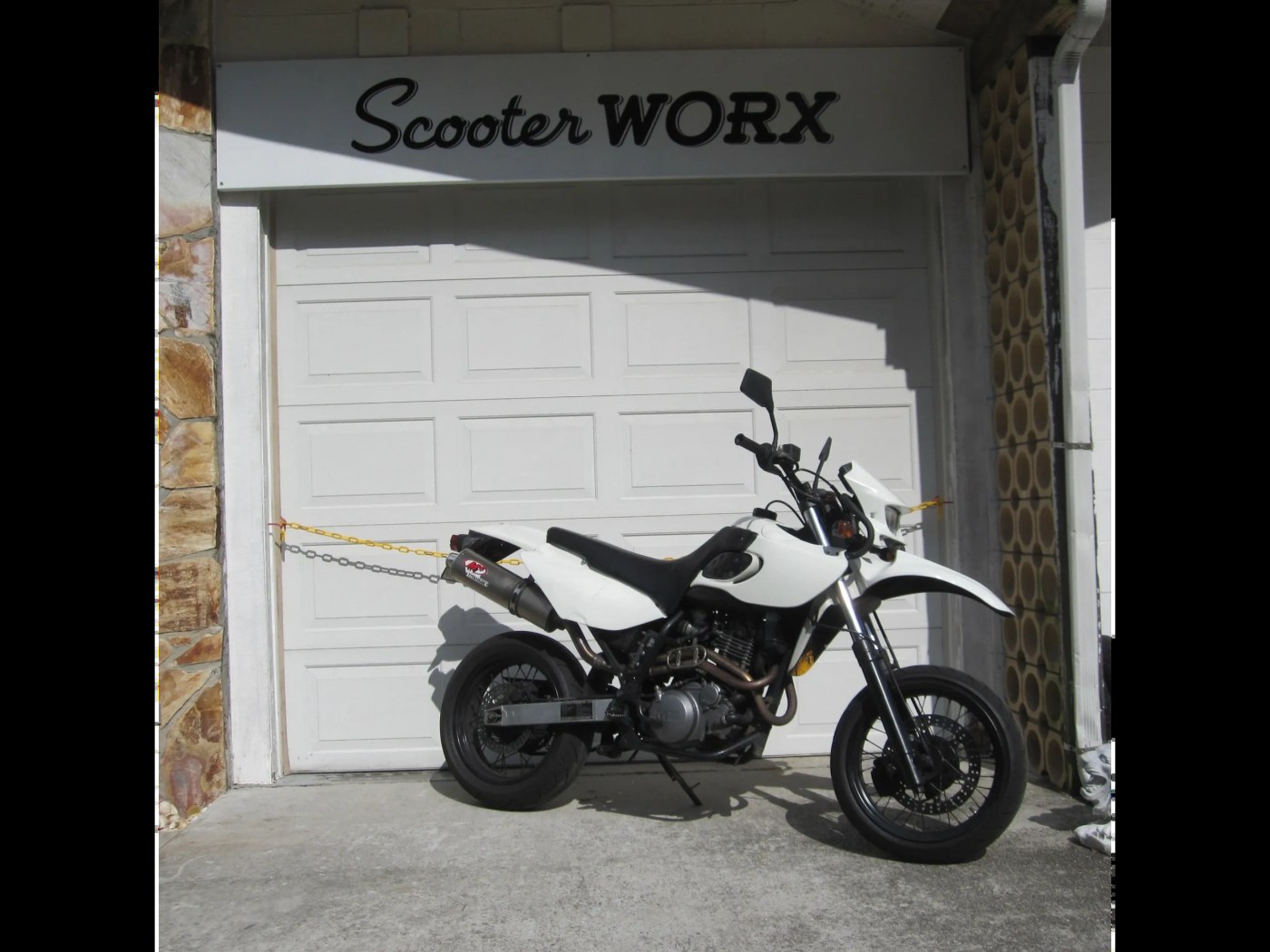 The MZ Baghira parked in front of Scooter WORX