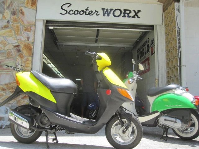 Scooter WORX storefront with the 2-stroke Geely out front